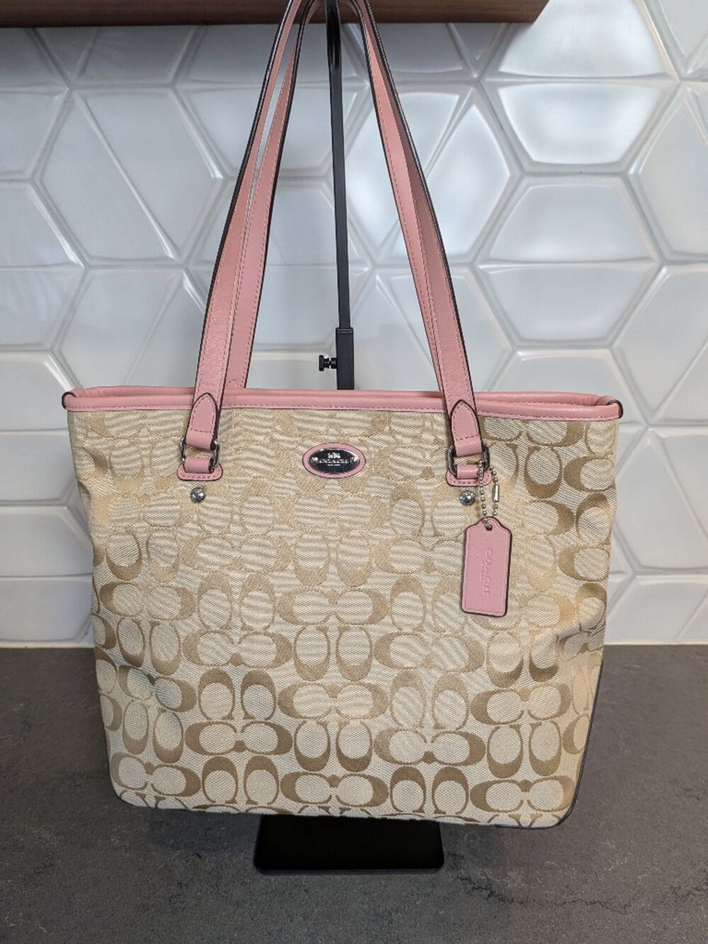 This Coach Zip Top Tote in Signature Canvas Pink Leather